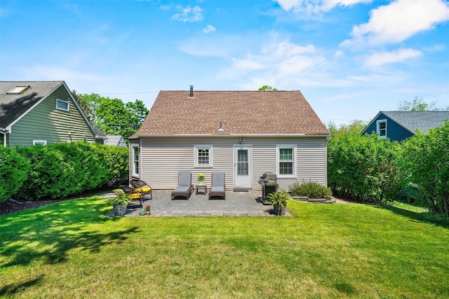 14 Mercer St, Middletown, NY 10940 - back of house featuring a patio area, a lawn, and a shingled roof