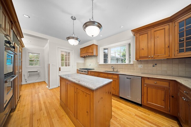 681 W 231st St, Bronx, NY 10463 - kitchen featuring appliances with stainless steel finishes, custom range hood, a sink, a kitchen island, and backsplash