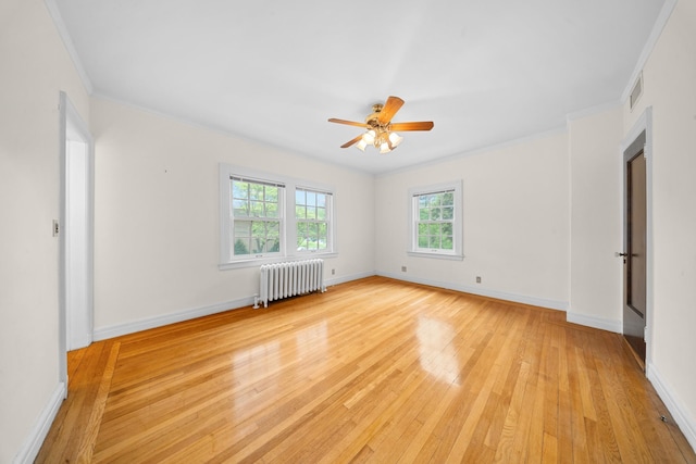 681 W 231st St, Bronx, NY 10463 - unfurnished room featuring radiator heating unit, light wood-type flooring, crown molding, a ceiling fan, and baseboards