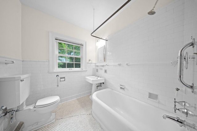 681 W 231st St, Bronx, NY 10463 - full bath with toilet, tile walls, tile patterned floors, and a wainscoted wall