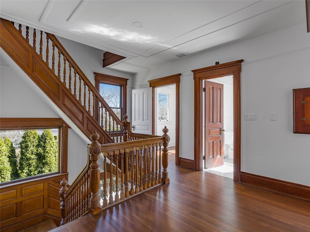 30 Huntting Ln, East Hampton, NY 11937 - staircase with healthy amount of natural light, wood finished floors, and baseboards