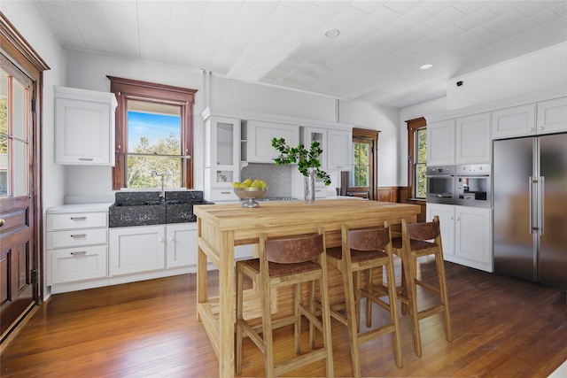 30 Huntting Ln, East Hampton, NY 11937 - dining room featuring dark wood-type flooring and recessed lighting