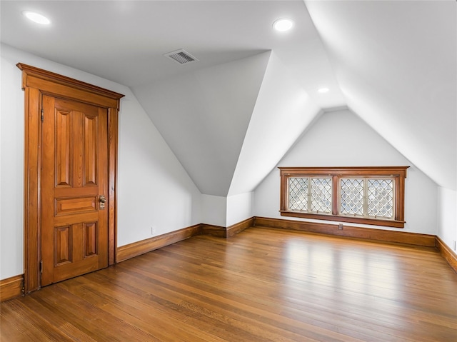 30 Huntting Ln, East Hampton, NY 11937 - additional living space with lofted ceiling, wood finished floors, baseboards, and recessed lighting
