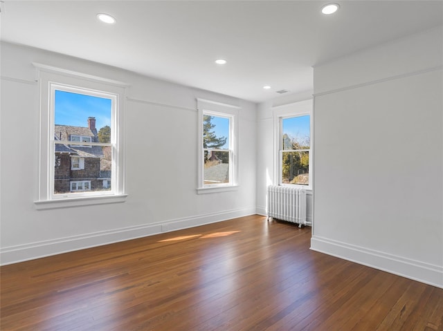 30 Huntting Ln, East Hampton, NY 11937 - spare room with radiator heating unit, hardwood / wood-style flooring, baseboards, and recessed lighting