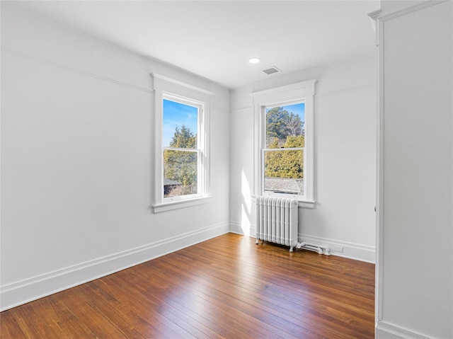 30 Huntting Ln, East Hampton, NY 11937 - spare room with radiator, plenty of natural light, wood-type flooring, baseboards, and recessed lighting