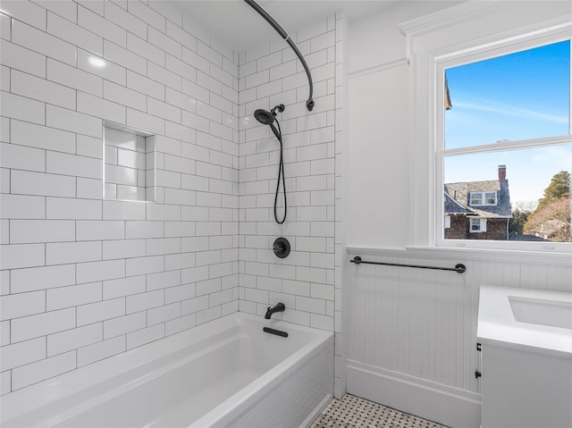 30 Huntting Ln, East Hampton, NY 11937 - bathroom with bathing tub / shower combination, wainscoting, and a sink
