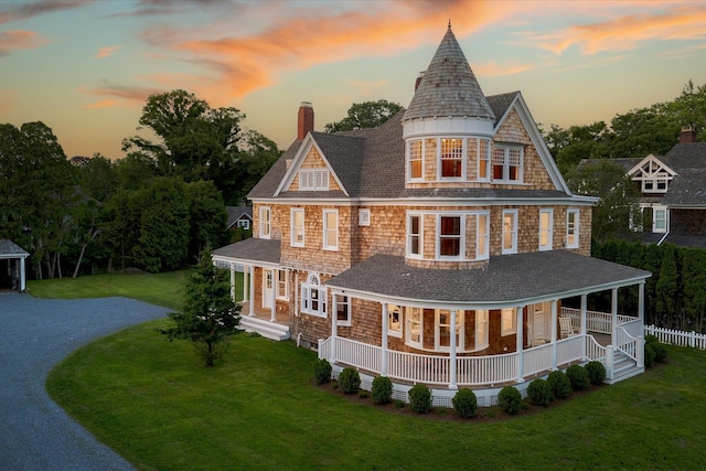 30 Huntting Ln, East Hampton, NY 11937 - back of house with a chimney, a porch, and a yard