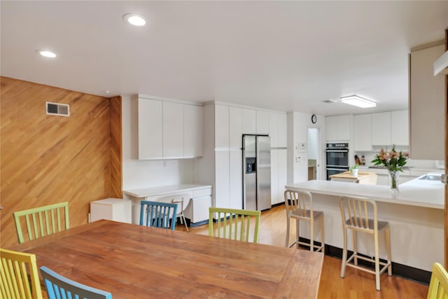 4 Bobby Close, Mamaroneck, NY 10543 - dining space with light wood-style flooring and recessed lighting