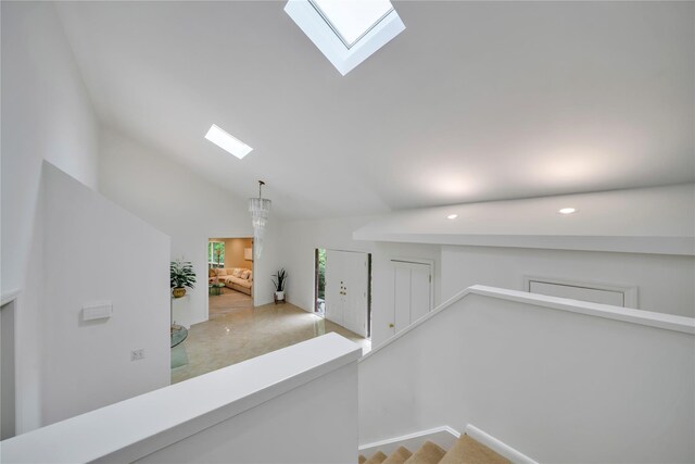 4 Bobby Close, Mamaroneck, NY 10543 - corridor featuring a skylight, recessed lighting, baseboards, high vaulted ceiling, and an upstairs landing