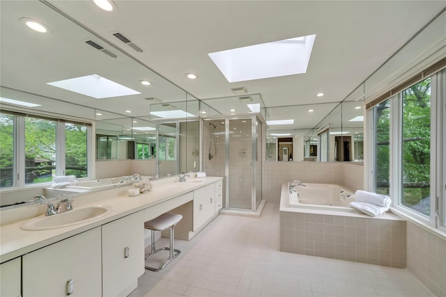 4 Bobby Close, Mamaroneck, NY 10543 - full bathroom with a skylight, a whirlpool tub, double vanity, healthy amount of natural light, and recessed lighting