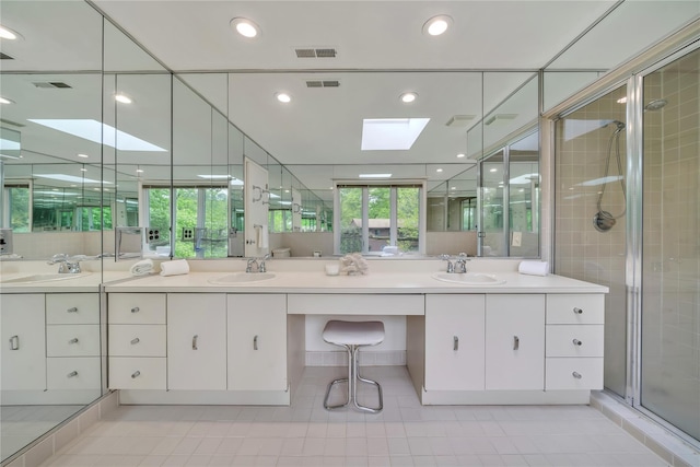4 Bobby Close, Mamaroneck, NY 10543 - full bath featuring double vanity, a skylight, a stall shower, tile patterned flooring, and recessed lighting