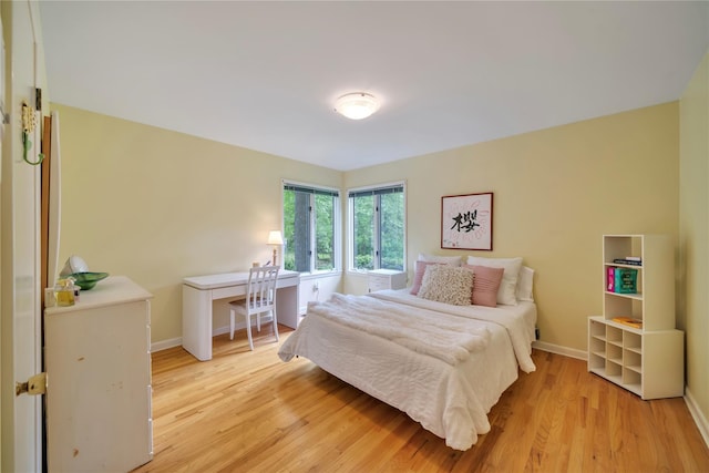 4 Bobby Close, Mamaroneck, NY 10543 - bedroom with light wood finished floors, baseboards, and an office area