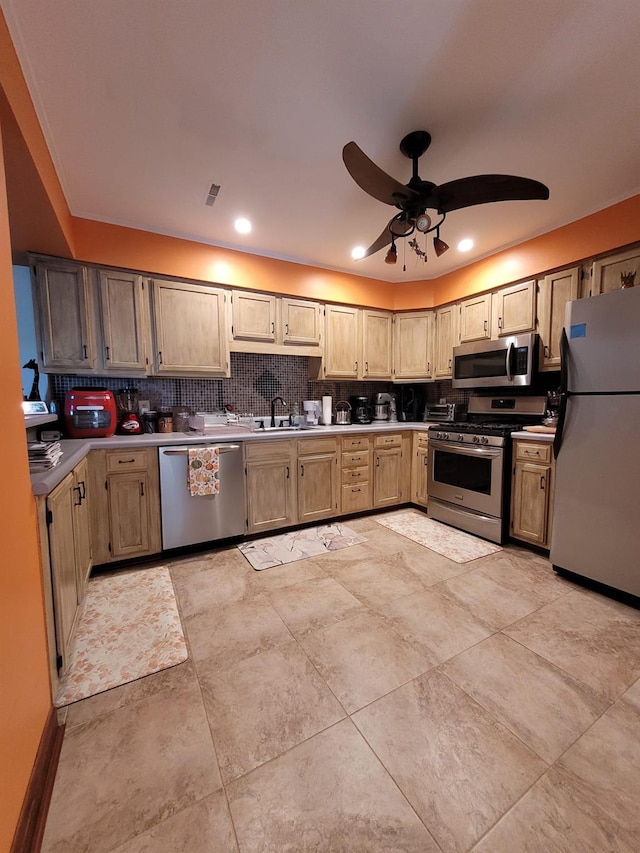 69 Laudaten Way, Warwick, NY 10990 - kitchen featuring stainless steel appliances, a sink, tasteful backsplash, ceiling fan, and light countertops