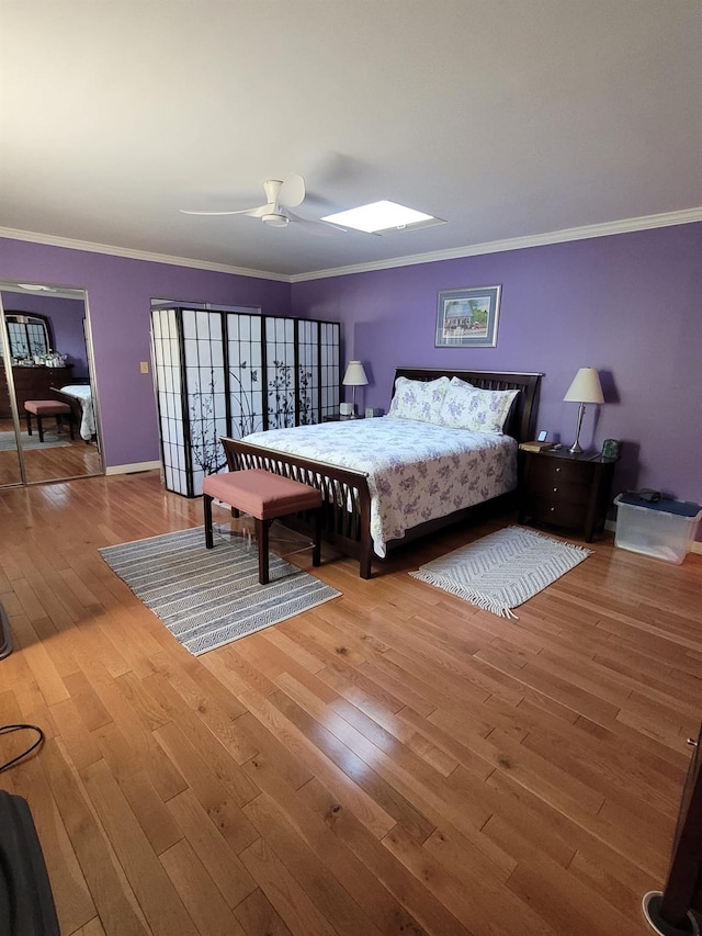 69 Laudaten Way, Warwick, NY 10990 - bedroom with ornamental molding, hardwood / wood-style floors, a skylight, ceiling fan, and baseboards