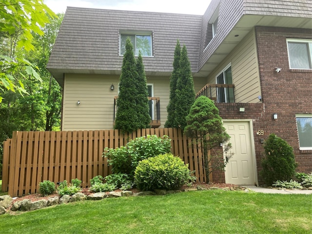 69 Laudaten Way, Warwick, NY 10990 - rear view of property featuring brick siding and mansard roof