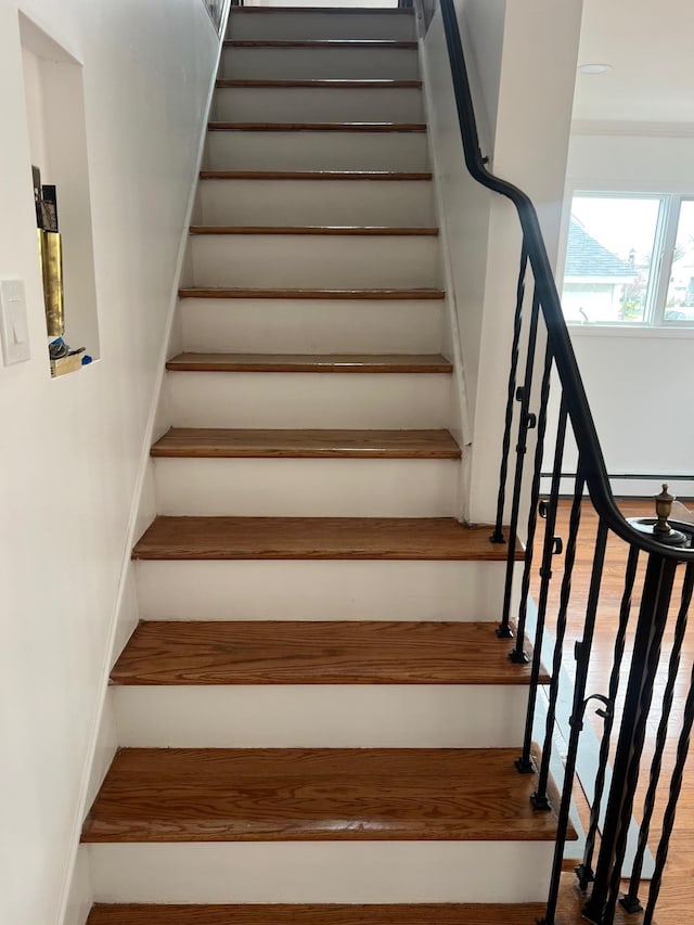 1963 Central Dr N, East Meadow, NY 11554 - stairway featuring wood finished floors