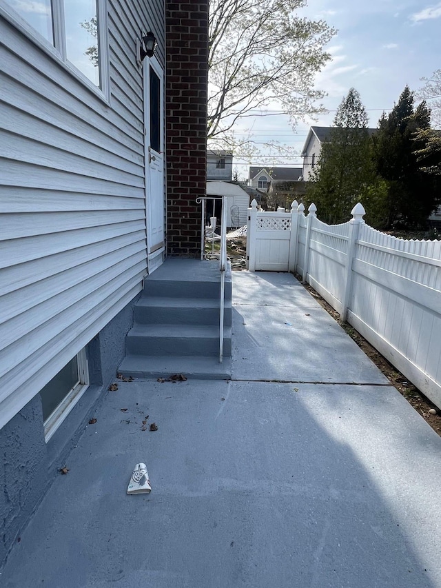 1963 Central Dr N, East Meadow, NY 11554 - view of patio featuring fence