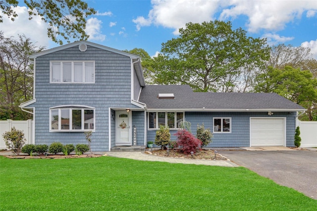 11 Mallard Ave, Selden, NY 11784 - traditional home with an attached garage and asphalt driveway