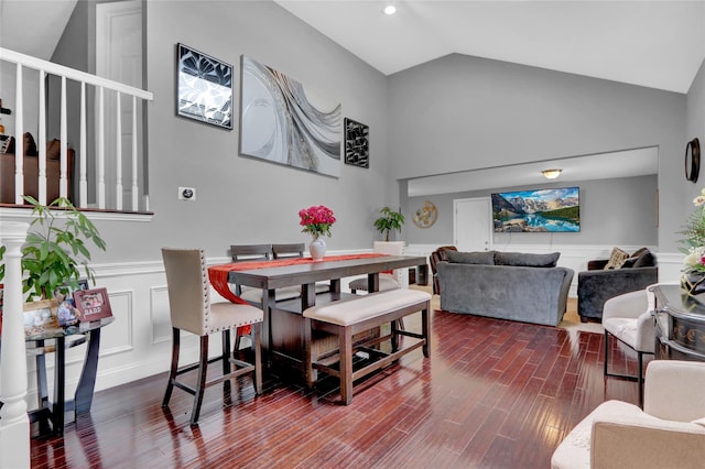 11 Mallard Ave, Selden, NY 11784 - dining room featuring wainscoting, vaulted ceiling, dark wood-style floors, and a decorative wall