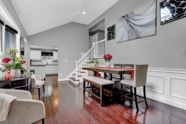 11 Mallard Ave, Selden, NY 11784 - dining space with vaulted ceiling, stairs, dark wood finished floors, recessed lighting, and a wainscoted wall