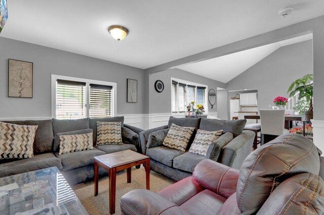 11 Mallard Ave, Selden, NY 11784 - carpeted living area with wainscoting and lofted ceiling