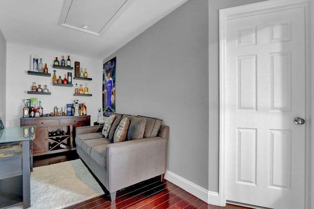 11 Mallard Ave, Selden, NY 11784 - living area with attic access, baseboards, and dark wood-style flooring
