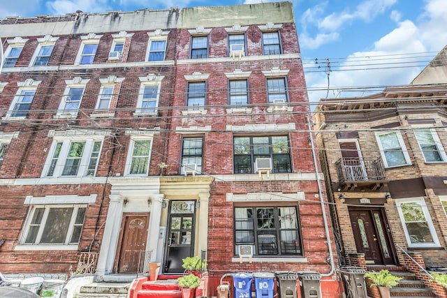 34-21 9th St, Astoria, NY 11106 - view of front of house featuring brick siding and cooling unit