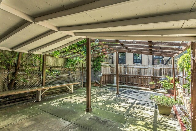 34-21 9th St, Astoria, NY 11106 - fenced backyard featuring a pergola and a patio