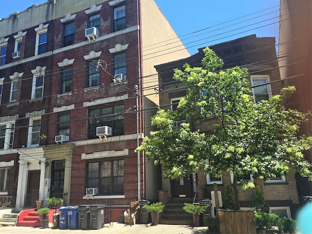 34-21 9th St, Astoria, NY 11106 - view of apartment building / complex featuring cooling unit and central air condition unit