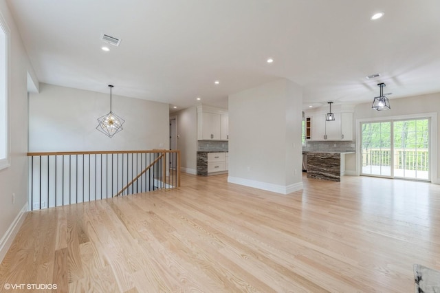 6 Reina Ct, Valley Cottage, NY 10989 - unfurnished living room with light wood-style floors, recessed lighting, and baseboards