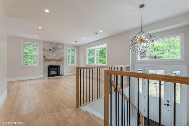 6 Reina Ct, Valley Cottage, NY 10989 - hallway featuring a chandelier, light wood-type flooring, an upstairs landing, recessed lighting, and baseboards