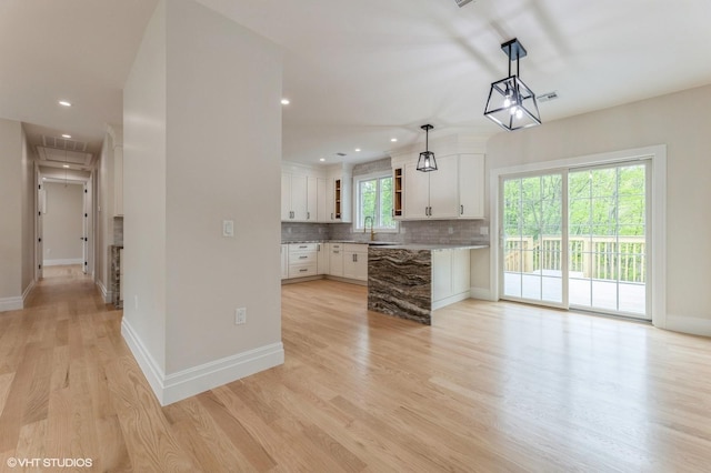 6 Reina Ct, Valley Cottage, NY 10989 - kitchen featuring decorative backsplash, white cabinets, light wood finished floors, baseboards, and recessed lighting