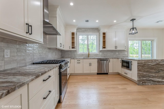 6 Reina Ct, Valley Cottage, NY 10989 - kitchen featuring stainless steel appliances, wall chimney range hood, a sink, healthy amount of natural light, and recessed lighting