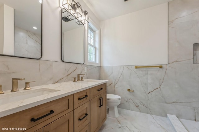 6 Reina Ct, Valley Cottage, NY 10989 - bathroom with tile walls, marble finish flooring, toilet, and double vanity