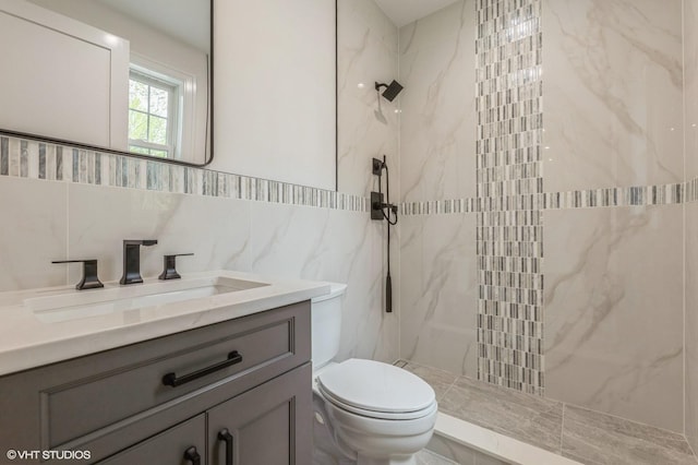 6 Reina Ct, Valley Cottage, NY 10989 - bathroom featuring toilet, a marble finish shower, tile walls, and vanity