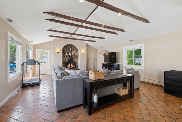 979 Manor Ln, Bay Shore, NY 11706 - living room featuring a baseboard radiator, a fireplace, baseboards, and dark tile patterned flooring