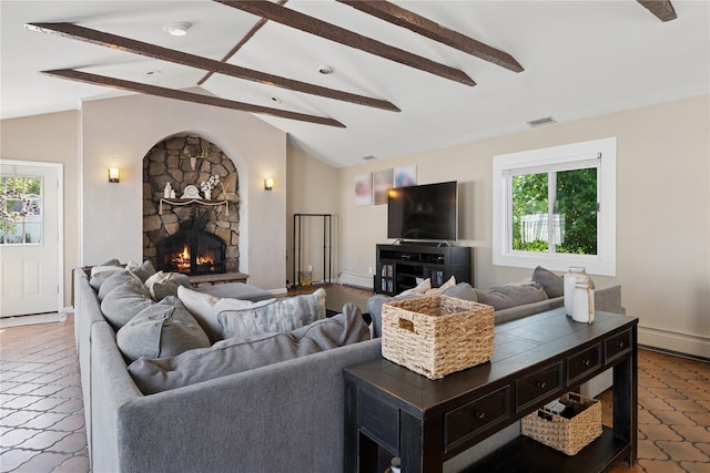 979 Manor Ln, Bay Shore, NY 11706 - living room with healthy amount of natural light, a stone fireplace, and tile patterned floors