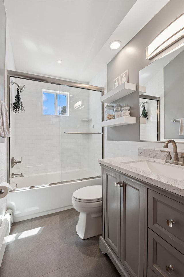 979 Manor Ln, Bay Shore, NY 11706 - bathroom with toilet, vanity, bath / shower combo with glass door, recessed lighting, and tile patterned flooring