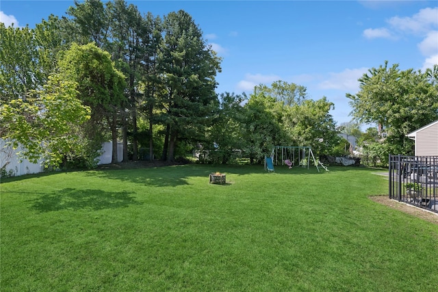 979 Manor Ln, Bay Shore, NY 11706 - view of yard with a playground and an outdoor fire pit