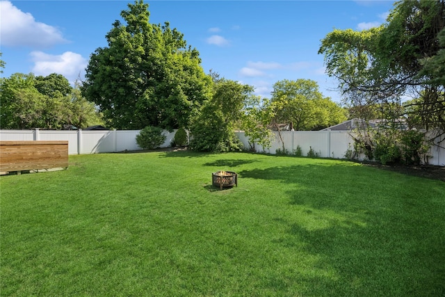 979 Manor Ln, Bay Shore, NY 11706 - view of yard featuring a fire pit