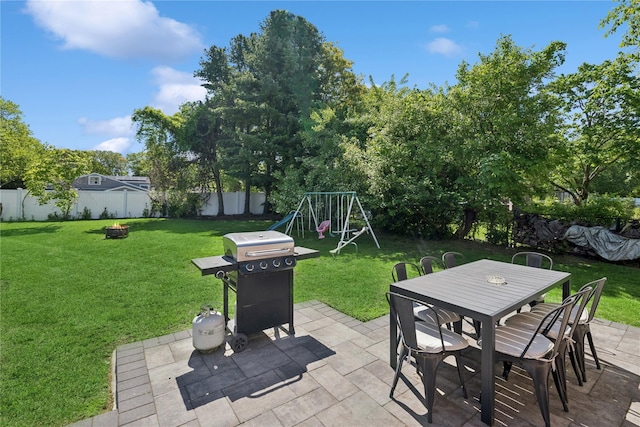 979 Manor Ln, Bay Shore, NY 11706 - view of patio / terrace featuring a grill, a playground, outdoor dining area, and a fire pit