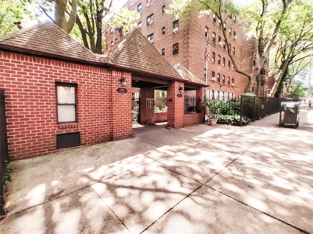 118-60 Metropolitan Ave Unit 6F, Kew Gardens, NY 11415 - back of property with brick siding and fence