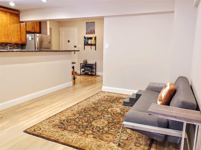 118-60 Metropolitan Ave Unit 6F, Kew Gardens, NY 11415 - living area featuring light wood-style floors, recessed lighting, and baseboards