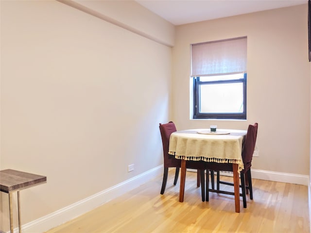 118-60 Metropolitan Ave Unit 6F, Kew Gardens, NY 11415 - dining room with light wood-type flooring and baseboards