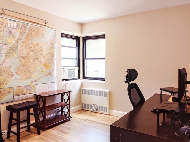 118-60 Metropolitan Ave Unit 6F, Kew Gardens, NY 11415 - office space with radiator heating unit, light wood finished floors, baseboards, and cooling unit
