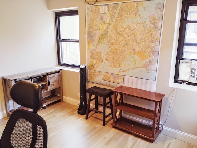 118-60 Metropolitan Ave Unit 6F, Kew Gardens, NY 11415 - home office featuring wood finished floors, baseboards, and healthy amount of natural light