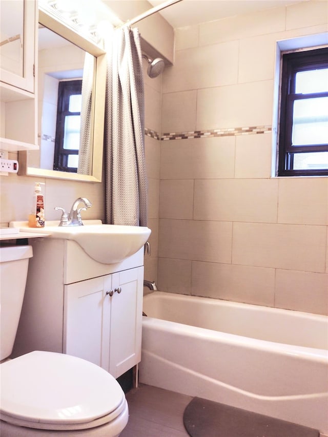 118-60 Metropolitan Ave Unit 6F, Kew Gardens, NY 11415 - bathroom with toilet, shower / tub combo with curtain, vanity, and plenty of natural light