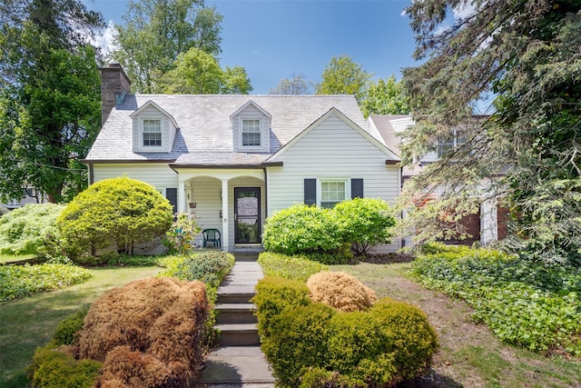 19 Reynal Rd, White Plains, NY 10605 - cape cod house with a chimney, a porch, and stairs