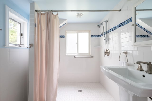 19 Reynal Rd, White Plains, NY 10605 - full bathroom featuring tiled shower, a sink, and tile walls