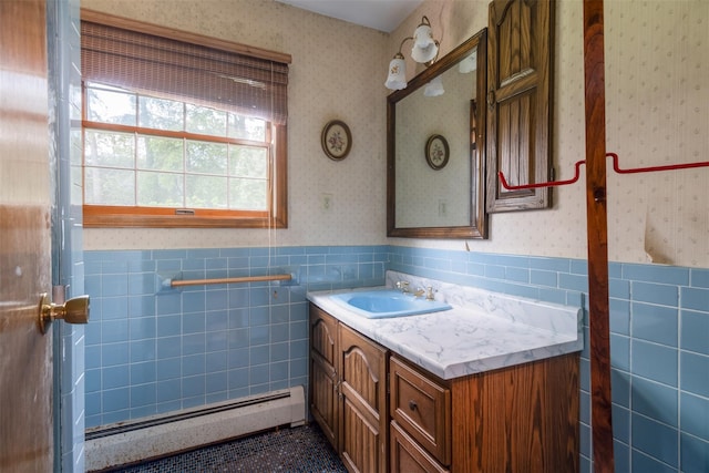 19 Reynal Rd, White Plains, NY 10605 - bathroom featuring a baseboard heating unit, wallpapered walls, a wainscoted wall, tile walls, and vanity
